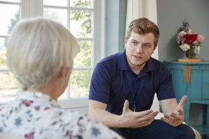 How Home Care Can Provide You and Your Parents with Peace of Mind - Senior woman talking with male care worker on home visit